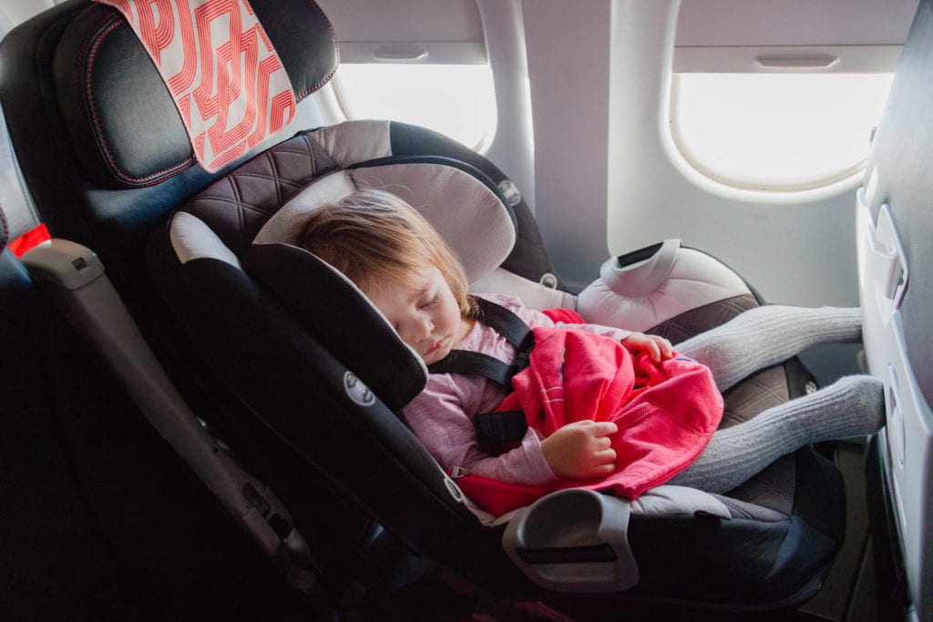 Toddler in Car Seat in plane